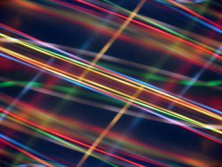 Black background with multicolored luminous lines