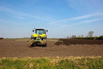 Fototapeta premium tractor in a plowed field