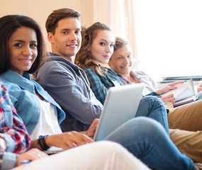 Fototapeta premium Group of students preparing for exams in apartment interior