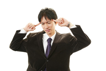 頭痛を訴えるビジネスマン