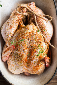 Spiced chicken with herbs in casserole dish