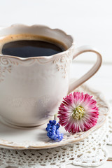 Closeup of coffee and spring flowers