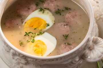 Closeup of sour soup spiced with marjoram