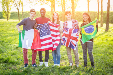 Teenage Friends Holding Flags from different Countries