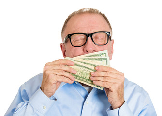 Portrait, headshot Stingy senior man, holding, smelling money