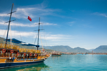 Tourist boats on the sea coast. Port in Alanya, Turkey