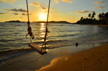 Empty Swing at Sunset Beach