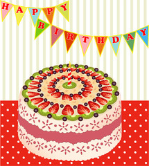 of a birthday cake with kiwi and strawberries