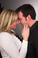 Young Couple Man Woman Engaged Standing Hugging Kissing Embrace
