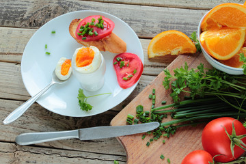 Healthy breakfast with boiled egg and fresh vegetables
