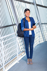 female afro american student holding books