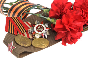 Soviet military cap with red flowers, Saint George ribbon, medal