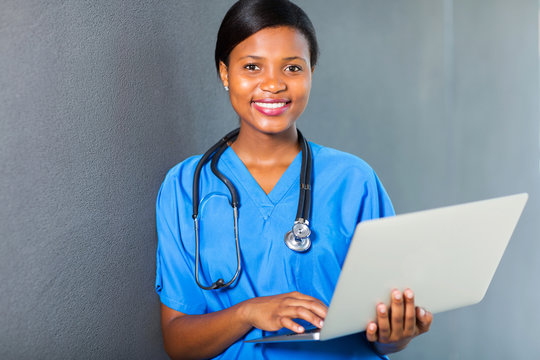 african american female nurse using laptop