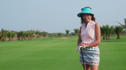 Happy people playing in golf club, sport, woman smiling - Powered by Adobe