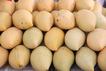 Ripe yellow mangoes in the fruit market.