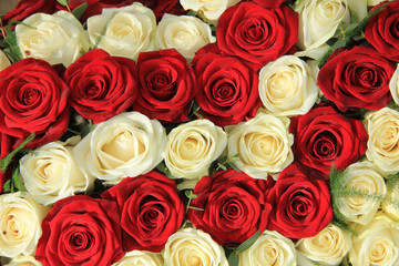 Red and white roses in a wedding arrangement