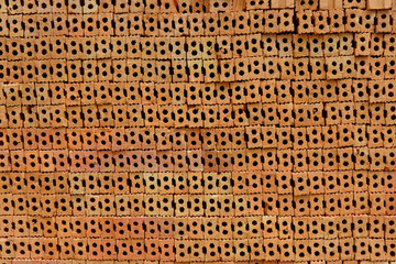 Stack of red bricks, bricks used for building construction