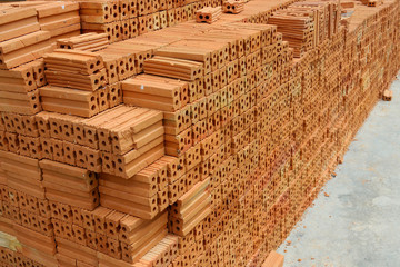 Stack of red bricks, bricks used for building construction