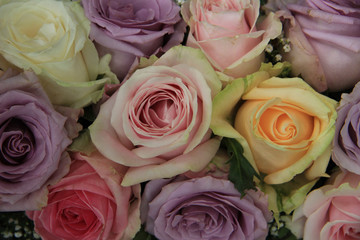 Pastel roses in bridal arrangement