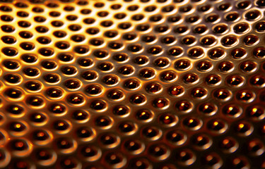 Metallic perforated texture in gold color