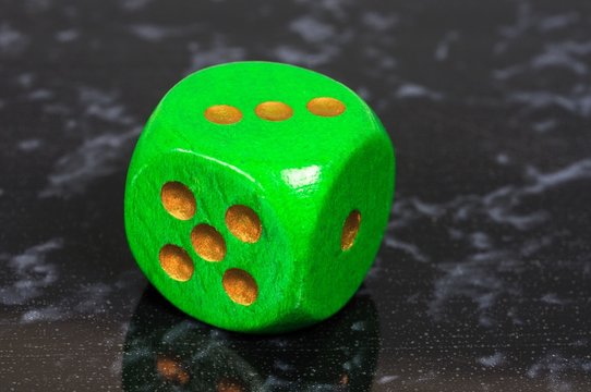 Green dice © Arena Photo UK