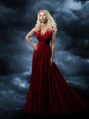 Woman in red dress, long hair blonde in fashion evening gown