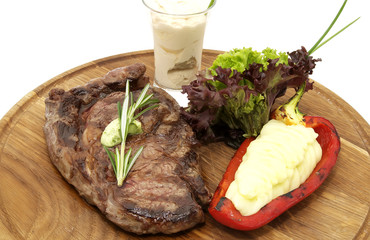 steak and mashed potatoes with gravy on a white background