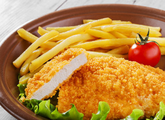 breaded chicken schnitzel fries