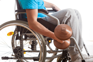 Man in wheelchair lifting weight