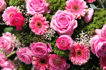 Ranunculus, roses and gerberas in a wedding arrangement