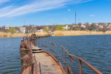 Pontoon bridge over small river to remote Ukrainian village