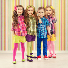 Cute fashion kids are standing together