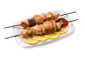 Skewers of chicken meat isolated on white background