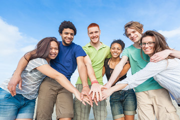 Multiracial Group of Friends with Hands on Stack