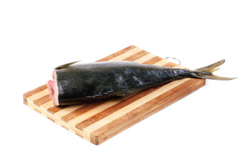 raw tuna un the cutting board isolated on white