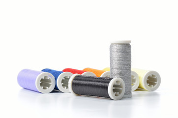 Colorful sewing threads isolated on white background