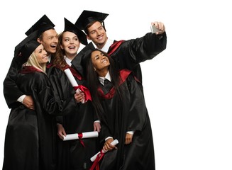 Multi ethnic group of graduated young students taking selfie