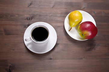 Breakfast -Fruit and coffee on a wood table