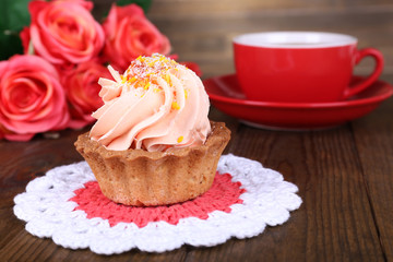 Tasty cake on table on wooden background