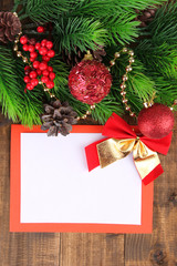 Fototapeta na wymiar Christmas card on wooden background
