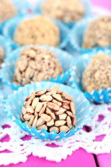 Set of chocolate candies, on wooden background