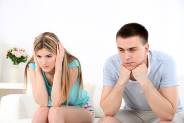 Portrait of young man and woman  conflict sitting