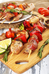 Pork kebab on wooden table close up