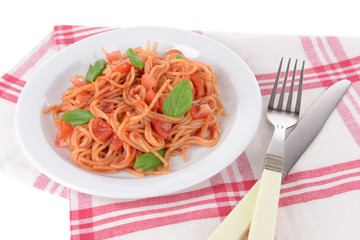 Pasta with tomato sauce on plate on table close-up