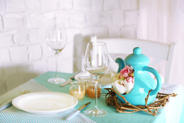 Fototapeta na wymiar Beautiful holiday Easter table setting in blue tones,