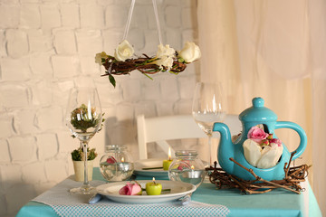 Beautiful holiday Easter table setting in blue tones,