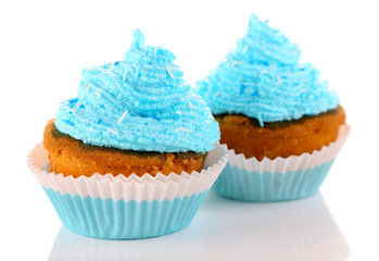 Tasty cup cakes with cream, isolated on white