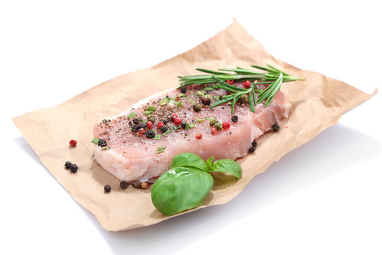 Raw meat steak with spices  herbs, isolated on white