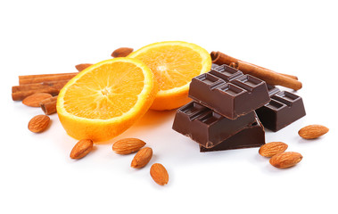 Chocolate, orange, cinnamon and almonds isolated on white
