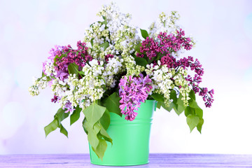 Beautiful lilac flowers in vase,